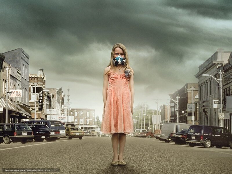 Girl in gas mask on street