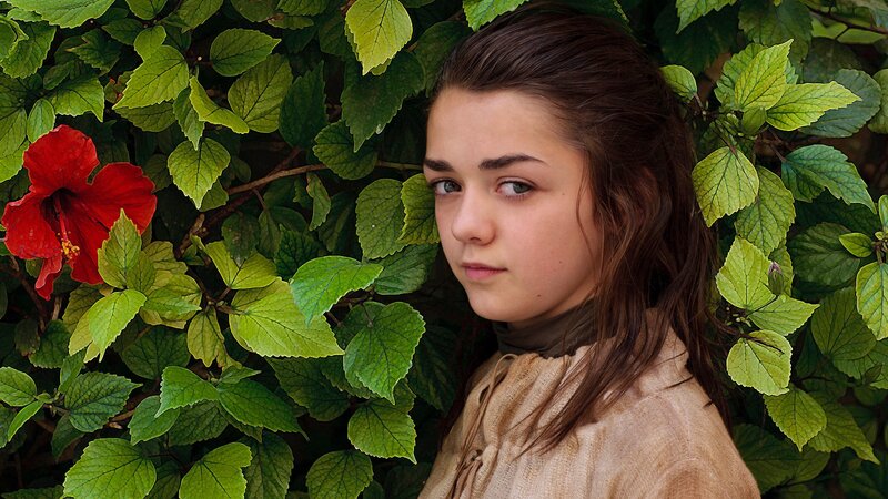 girl in green foliage