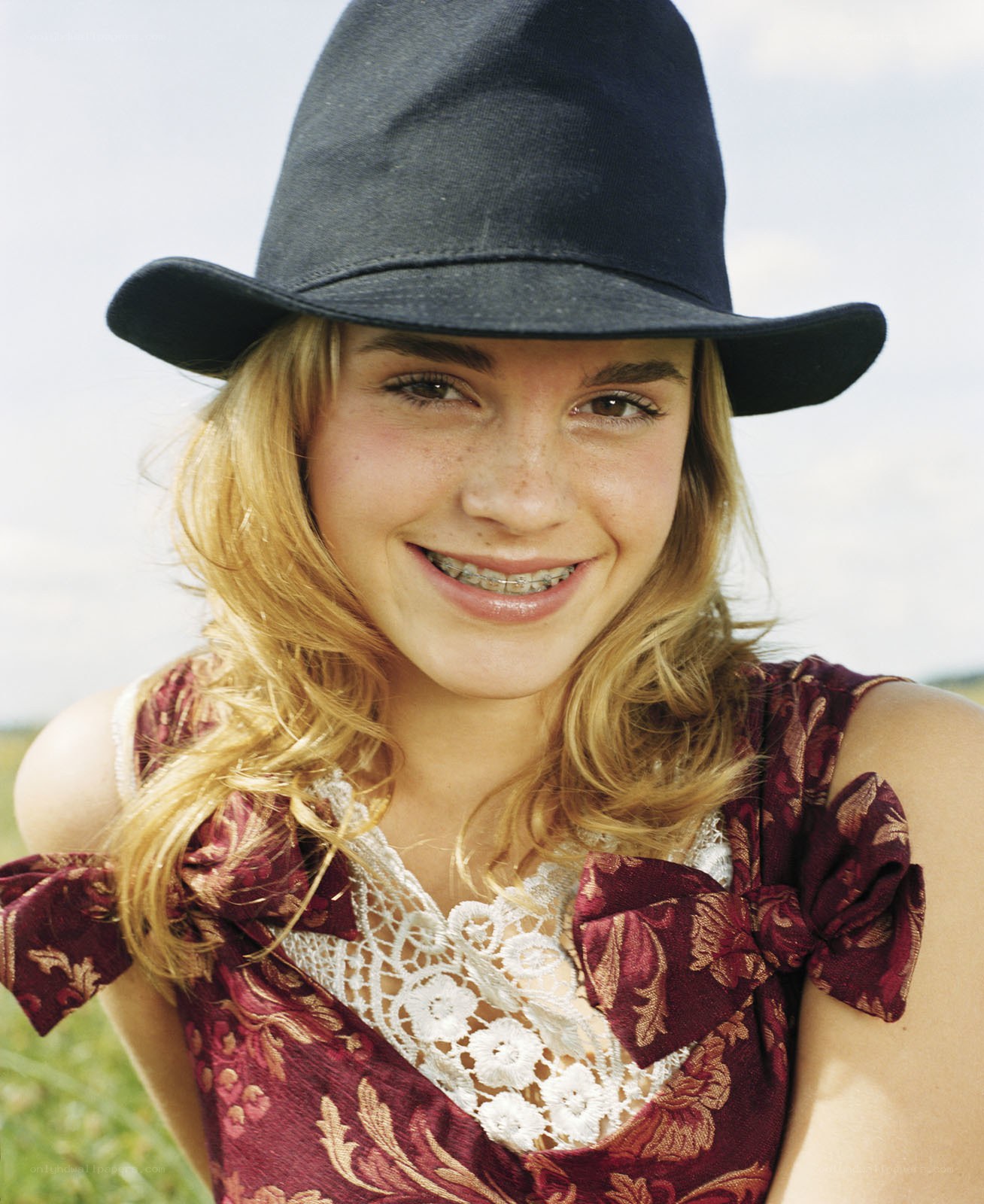 girl in hat smiling