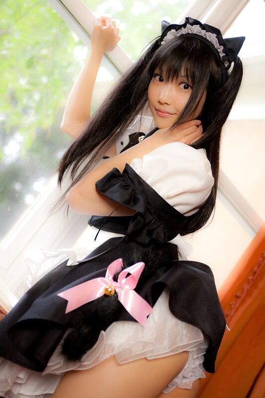 girl in maid costume by window