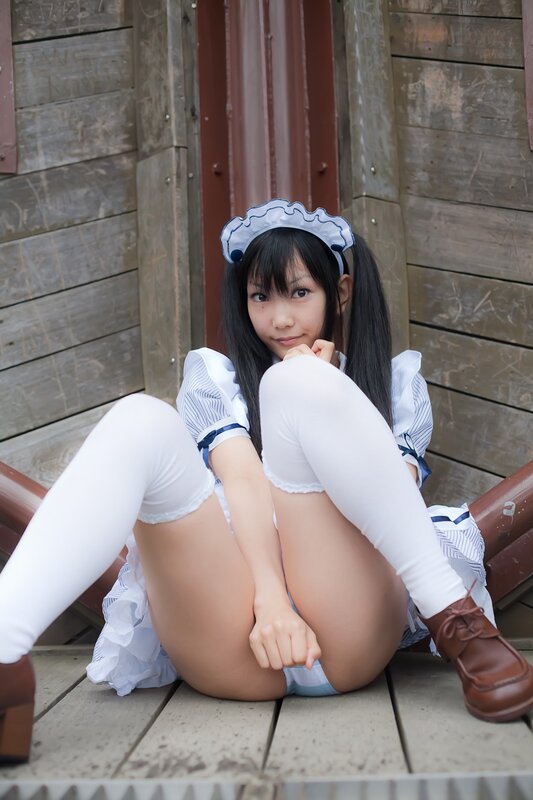 girl in maid costume sitting