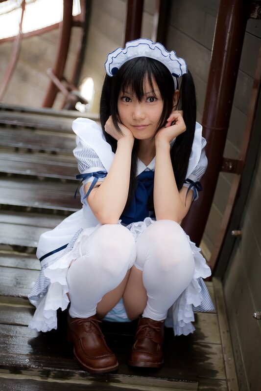 girl in maid costume sitting