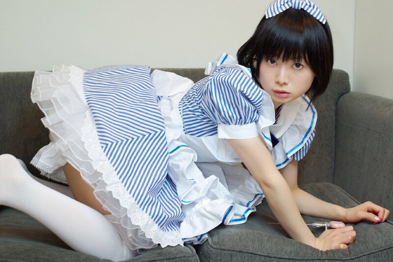 girl in maid outfit on couch