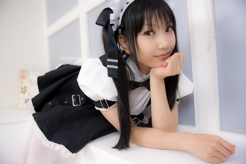 girl in maid outfit posing