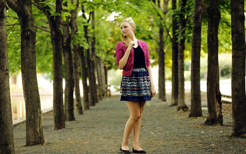 Girl in park with floral hair accessory