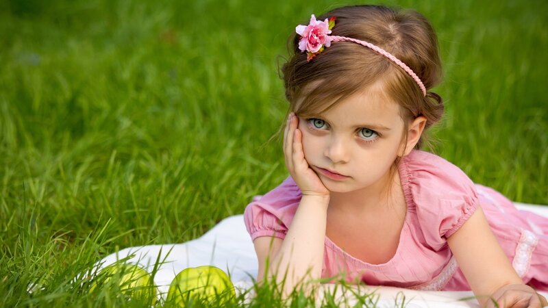 girl in pink dress on grass