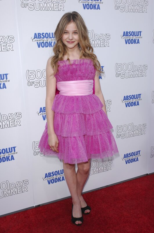 girl in pink dress on red carpet