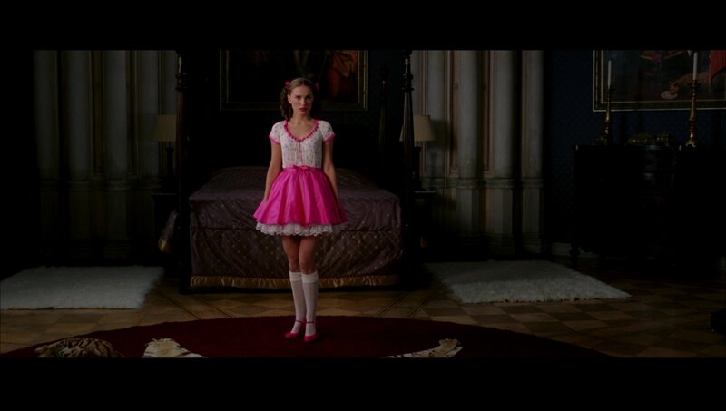 girl in pink dress standing