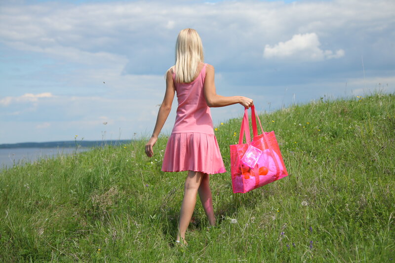 Girl in pink dress walking