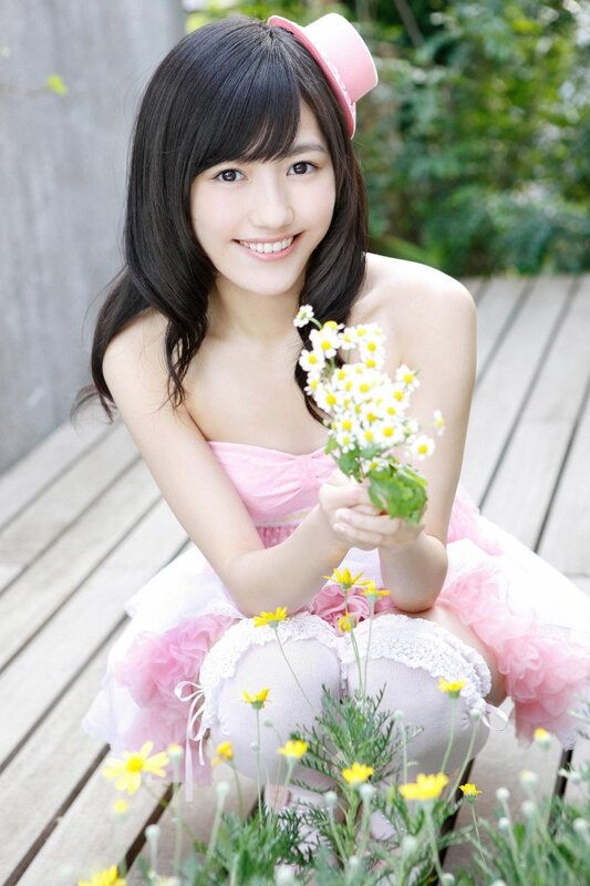 Girl in pink dress with flowers