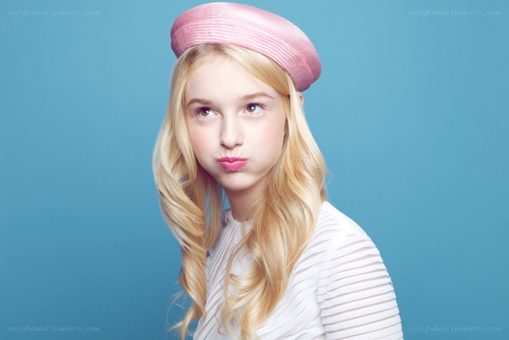 girl in pink hat posing