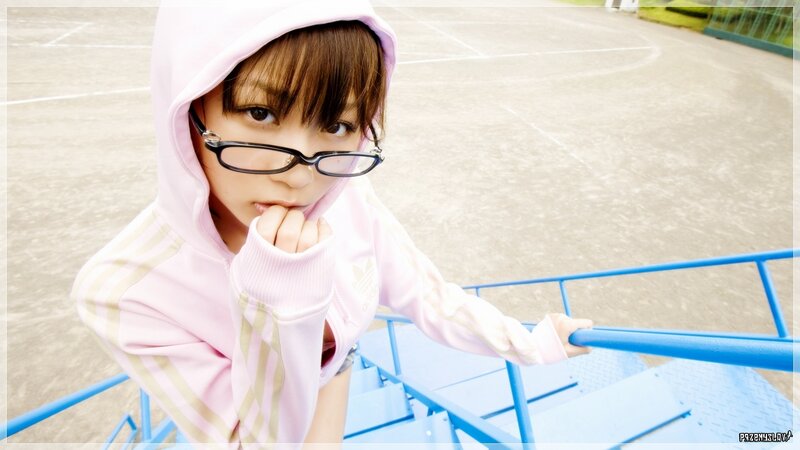 girl in pink hoodie on playground