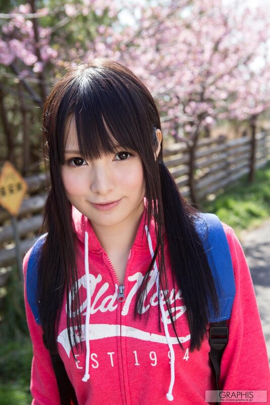 Girl in pink hoodie with cherry blossoms