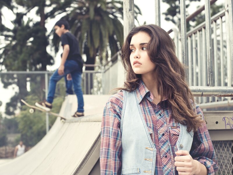Girl in plaid at skate park