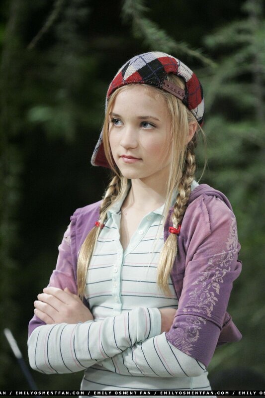 girl in plaid hat and purple hoodie