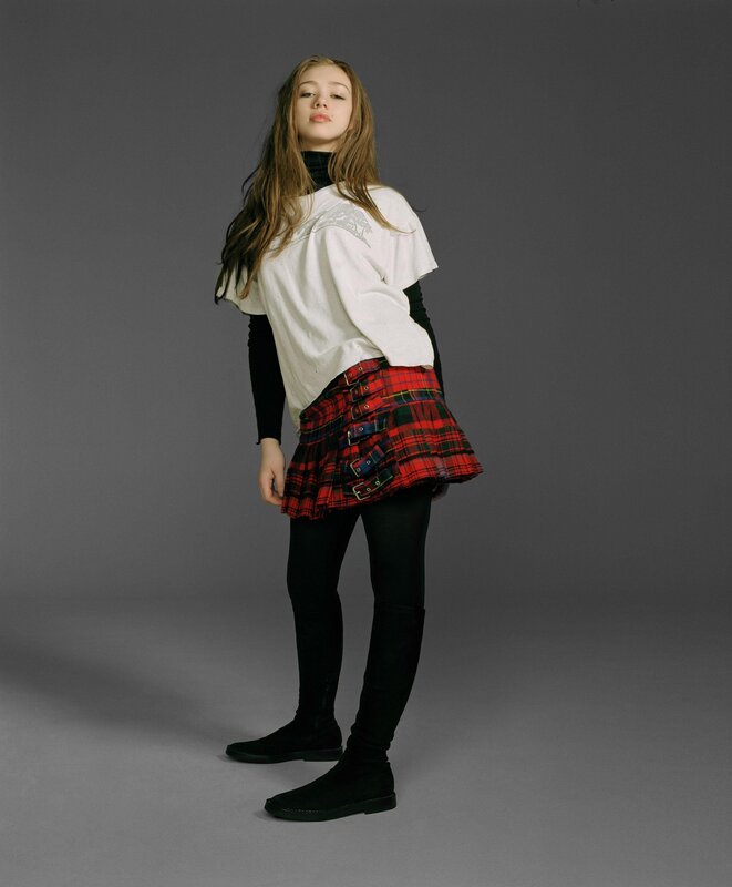 girl in plaid skirt and white shirt