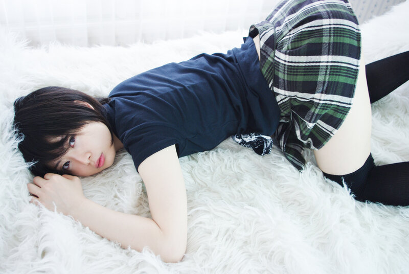 girl in plaid skirt lying down