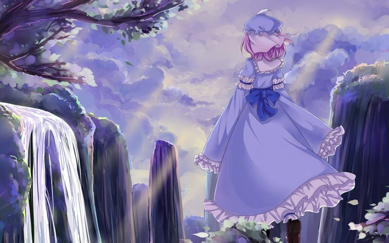 girl in purple dress by waterfall