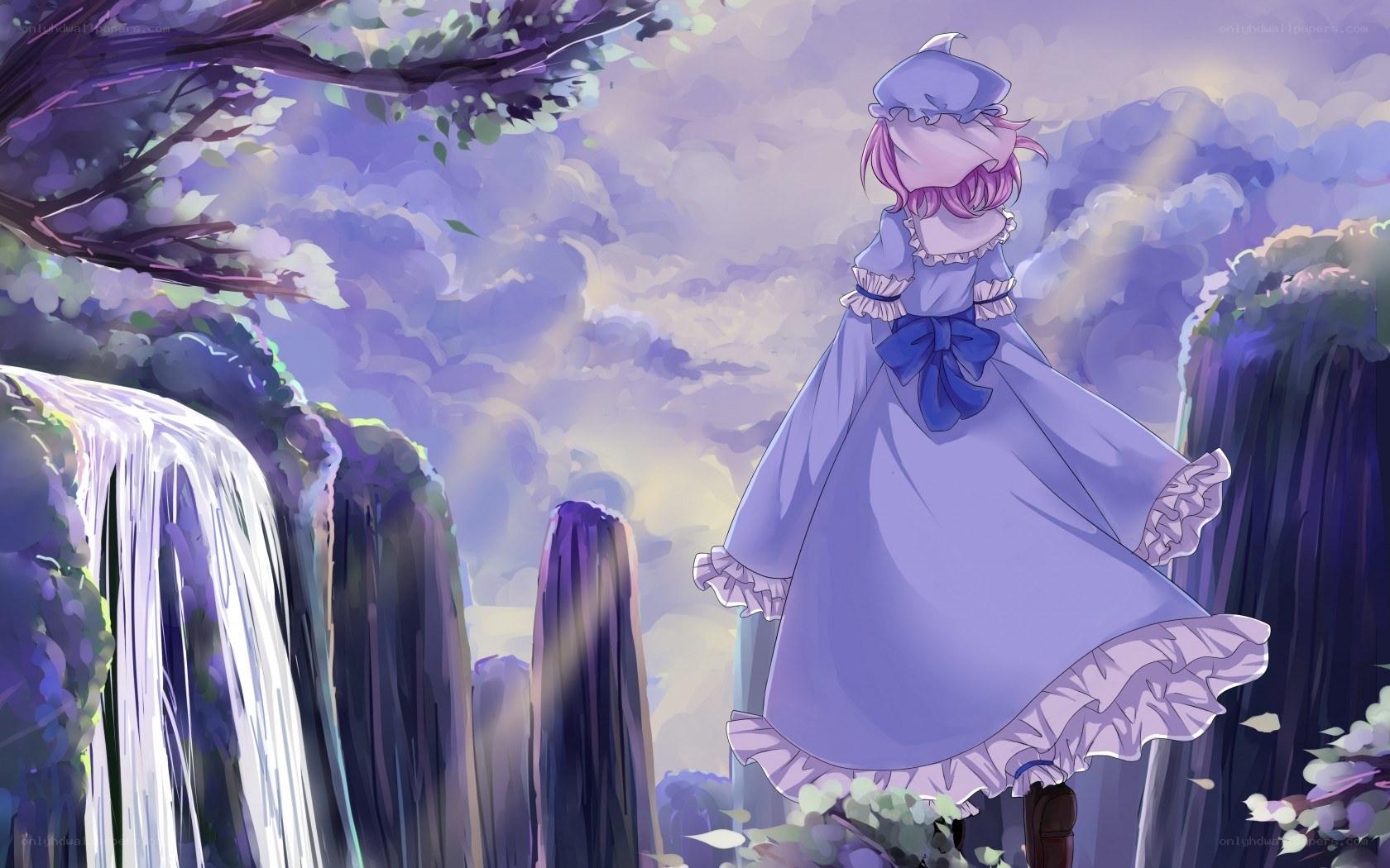 girl in purple dress by waterfall