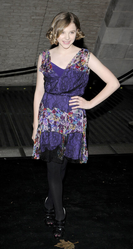 girl in purple floral dress