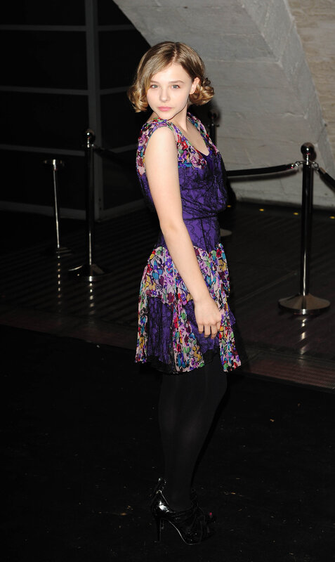 girl in purple floral dress