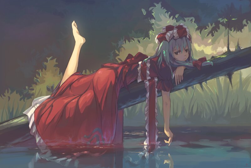 girl in red dress by water