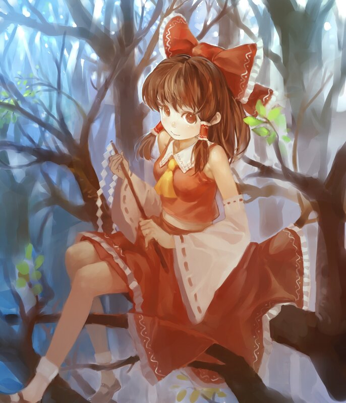 Girl in red dress on tree branch