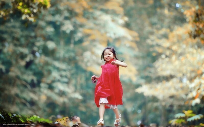 Girl in red dress running