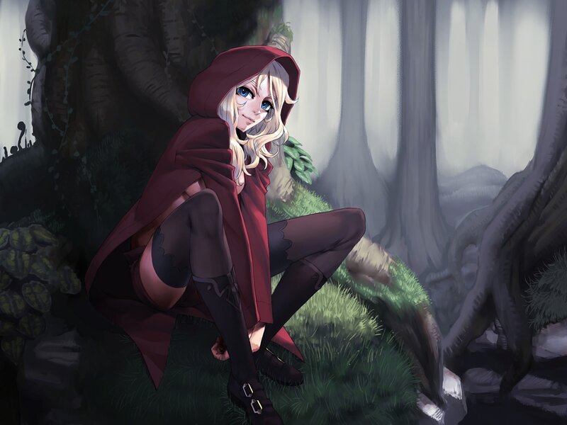 girl in red hood in forest