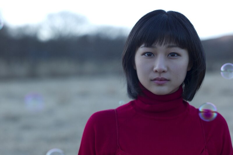 girl in red sweater with bubbles