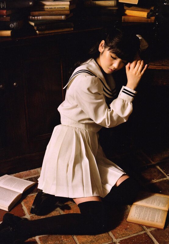 girl in sailor uniform kneeling