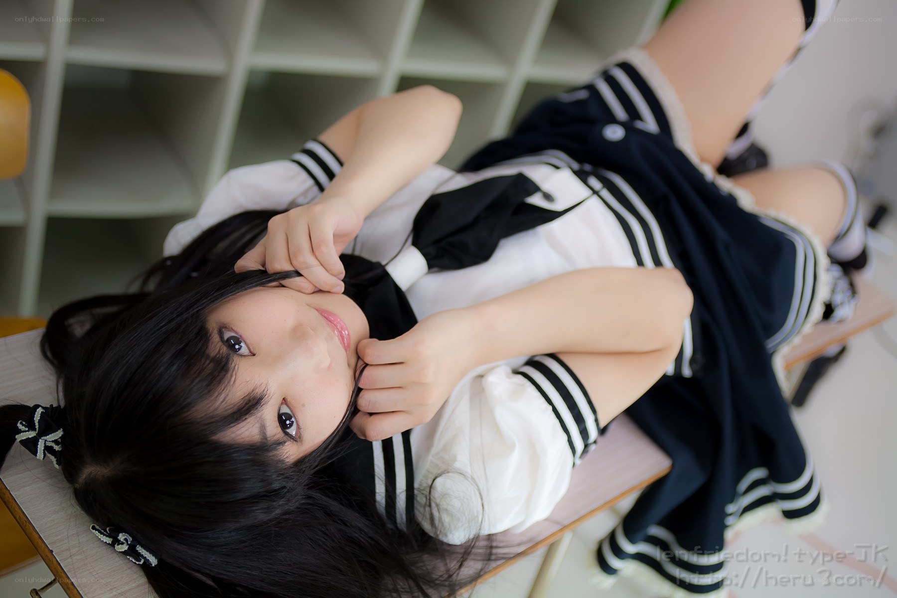 girl in sailor uniform lying down