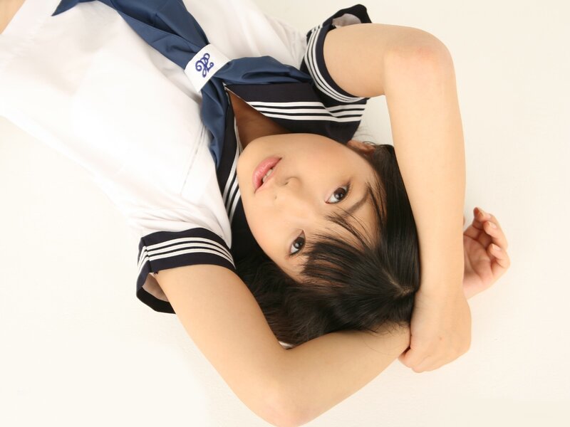 girl in sailor uniform lying down
