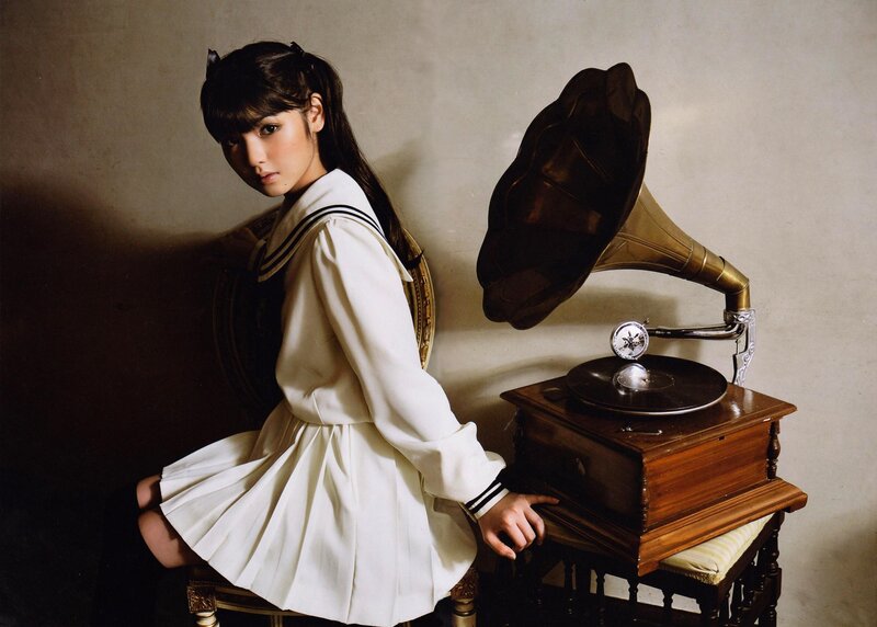 Girl in sailor uniform with gramophone