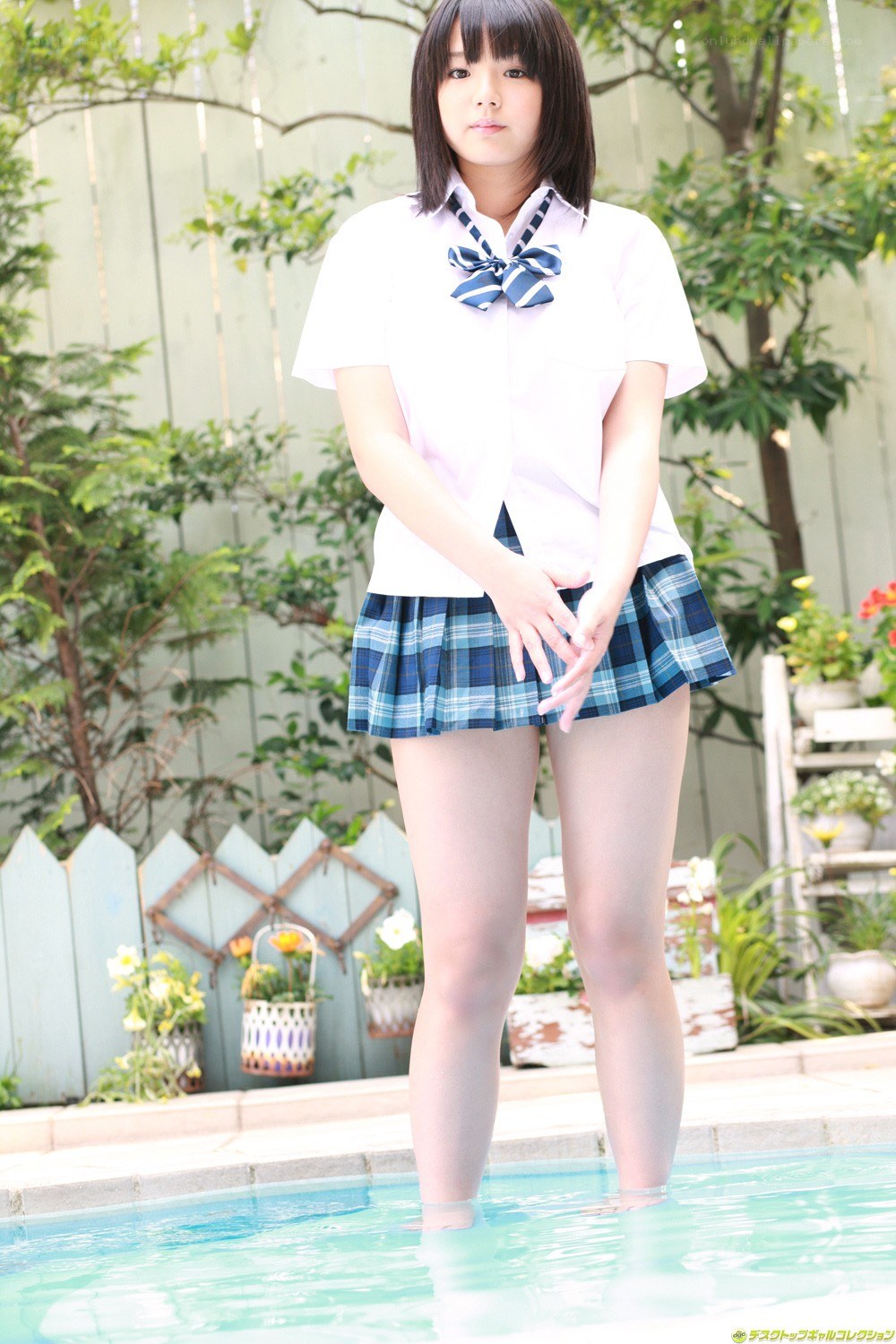 girl in school uniform by pool