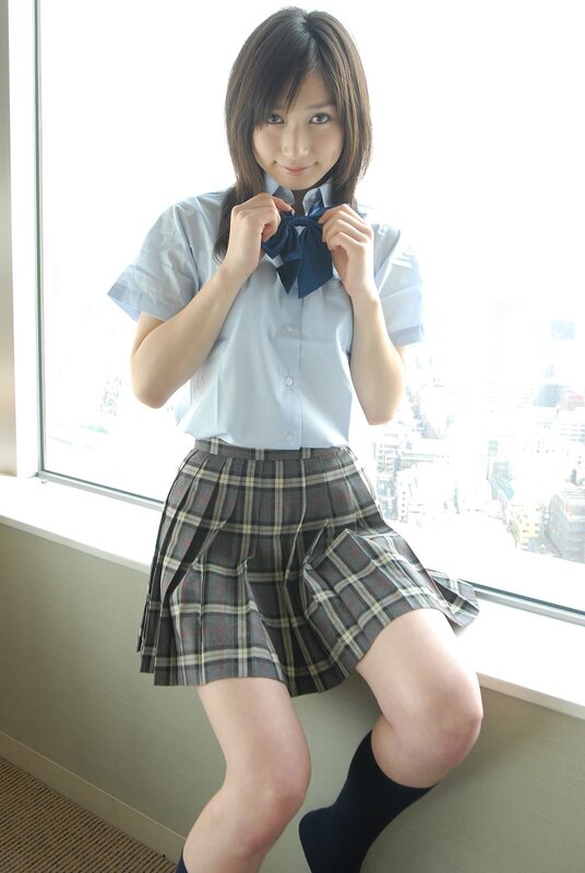 girl in school uniform by window