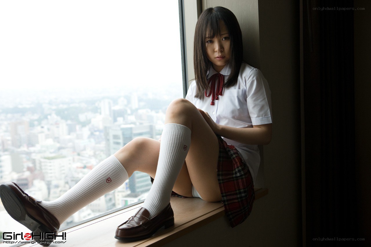 girl in school uniform by window