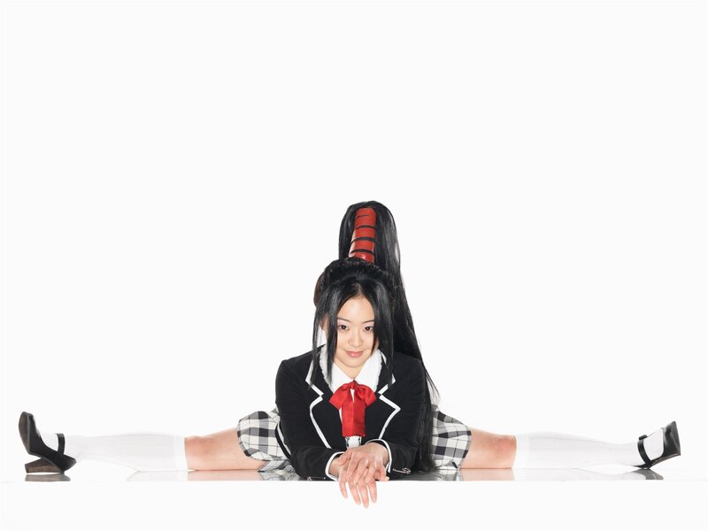girl in school uniform doing split