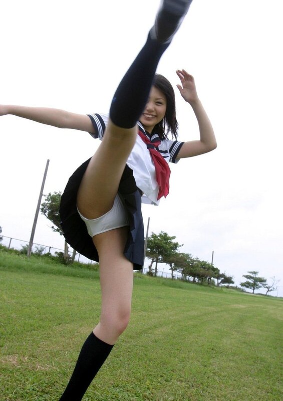 girl in school uniform kicking