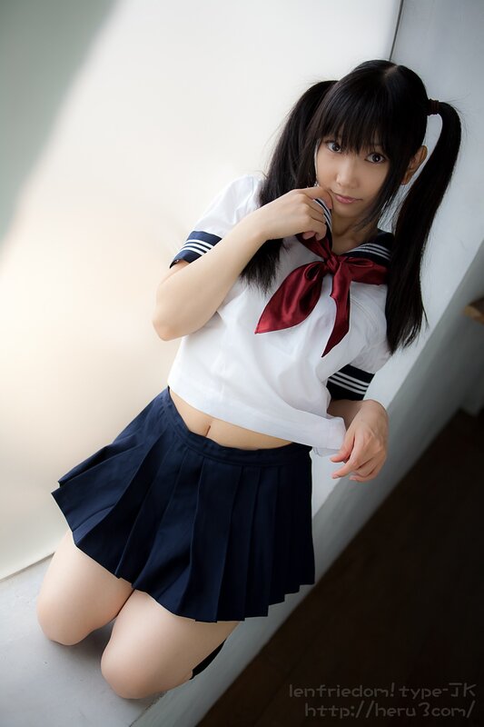 girl in school uniform kneeling