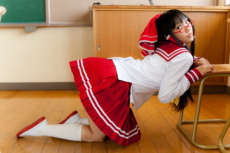 girl in school uniform kneeling
