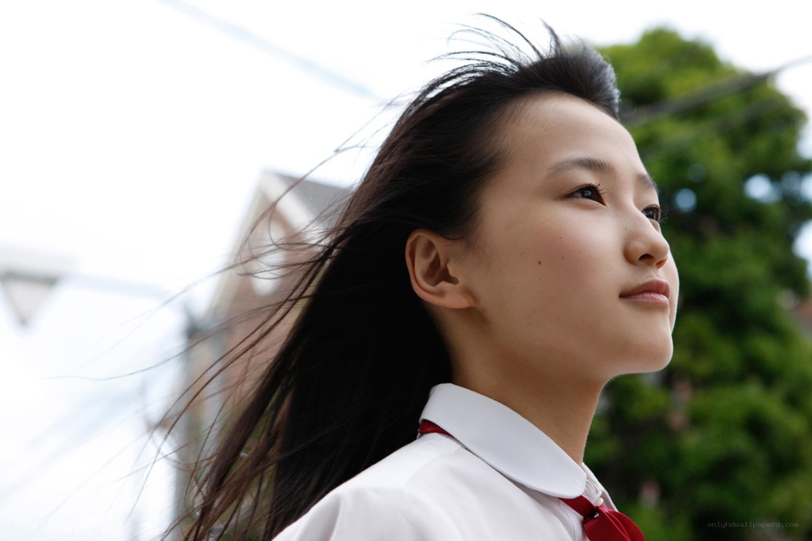 girl in school uniform looking up