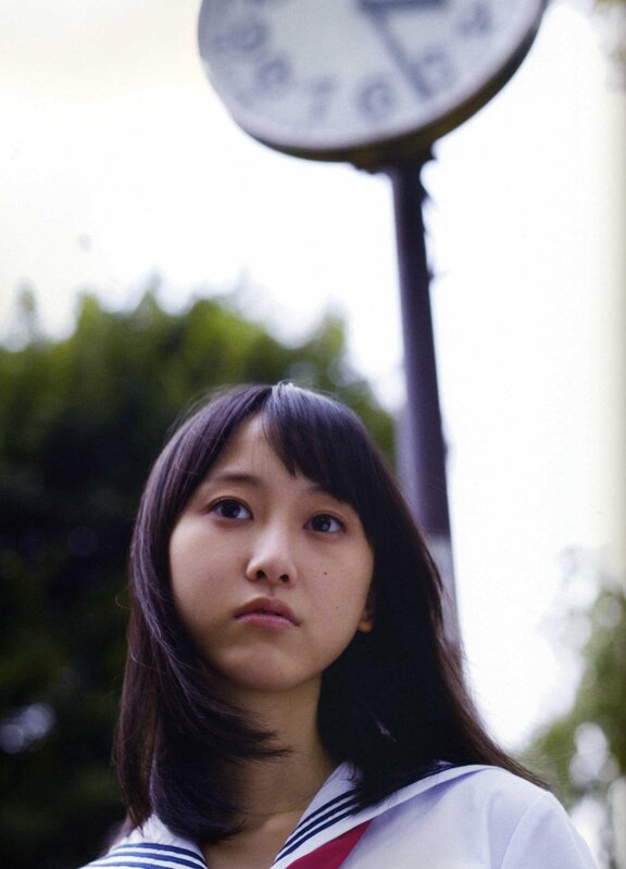girl in school uniform looking up