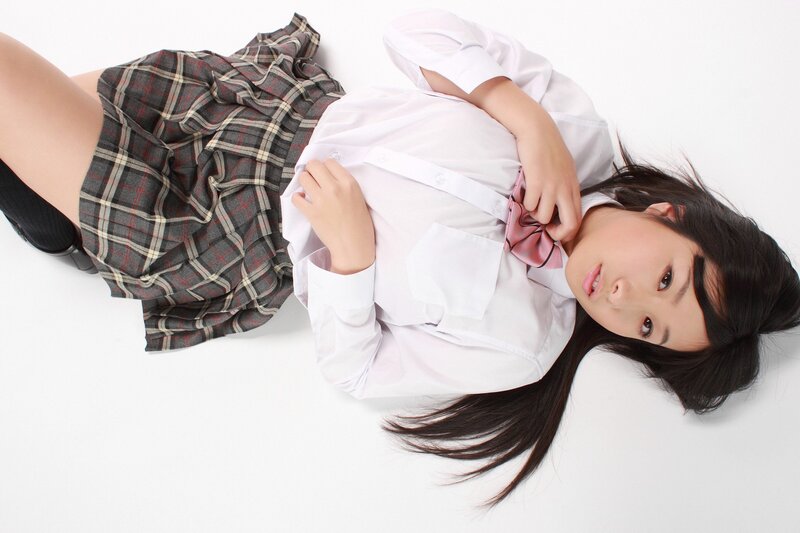 girl in school uniform lying down