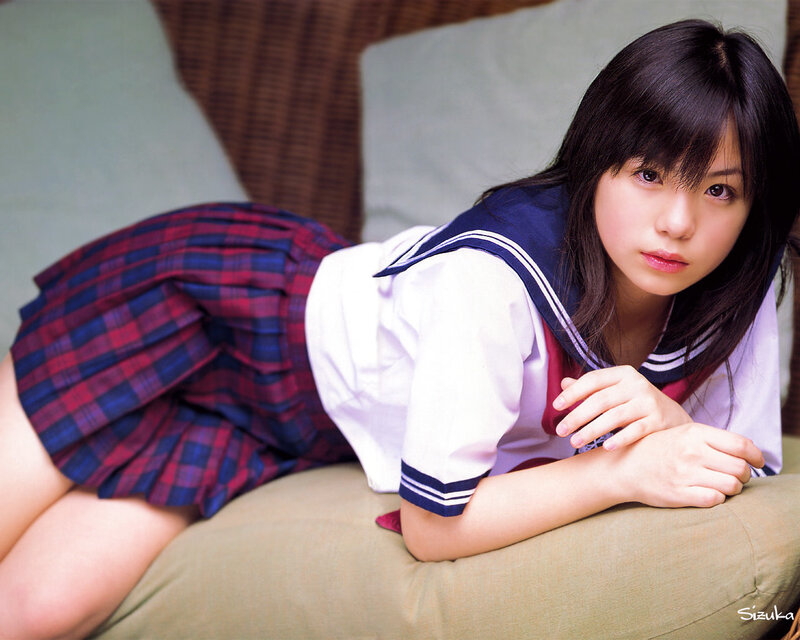 girl in school uniform lying down