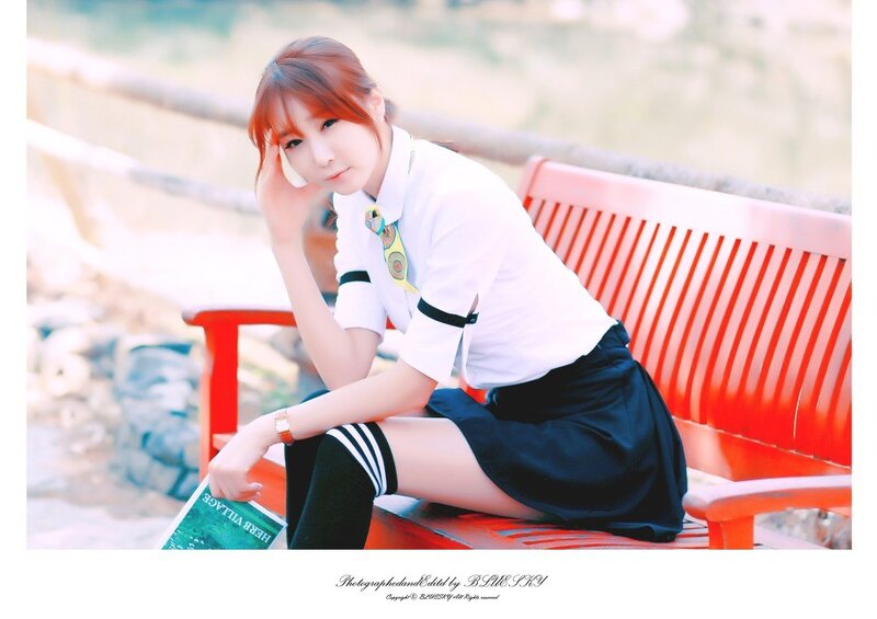girl in school uniform on bench