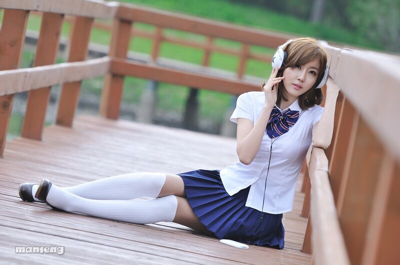 girl in school uniform on bridge