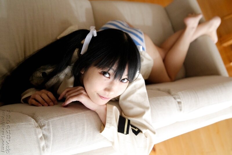 girl in school uniform on couch
