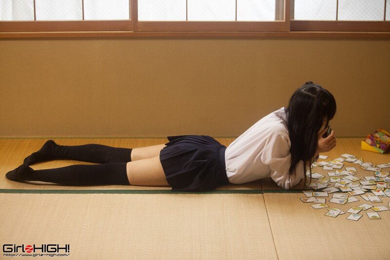 Girl in school uniform on floor