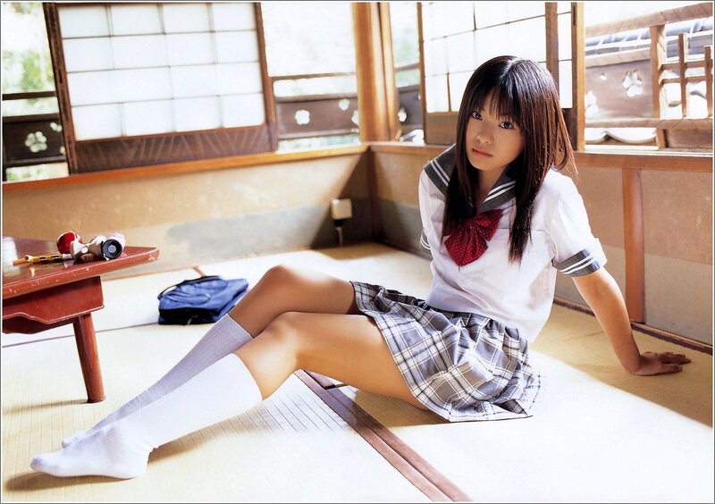 girl in school uniform on floor